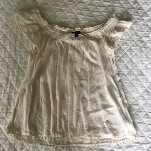 Cream off the shoulder detailed top